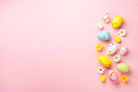 Easter eggs and decorations on pink background. Flat lay image with copy space.の写真素材