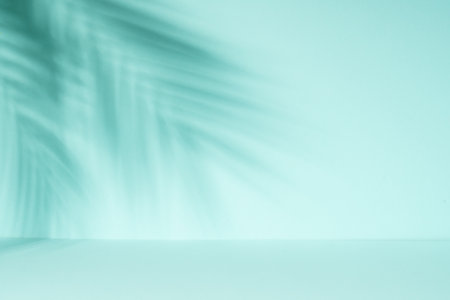 Art abstract background with palm shadows at blue. Empty space for design.の写真素材