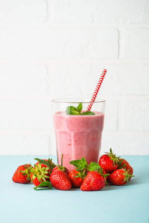 Strawberry smoothie or milkshake at blue.の写真素材