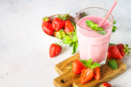 Strawberry smoothie or milkshake with fresh berries.の写真素材
