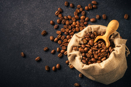 Roasted coffee beans in tha sack bag. Natural coffee beans. Top view with copy spaceの写真素材