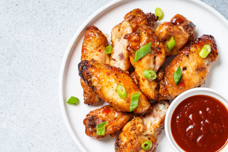 Chicken wings in bbq sauce. Meat dish. Close up.の写真素材