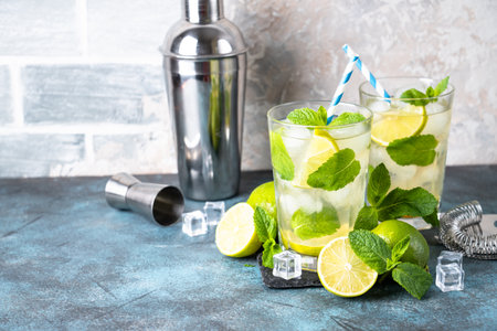Mojito with rum and lime on black background. Tradition Summer drink with ice.の写真素材
