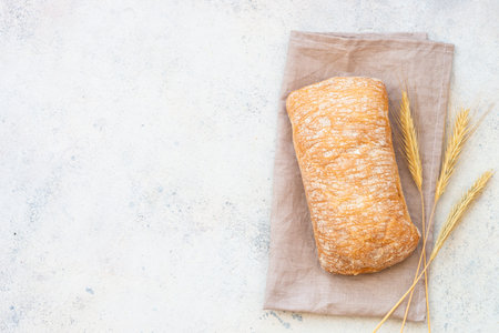 Italian Ciabatta bread on white background. Top view with space for text.の写真素材