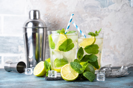 Mojito with rum and lime on black background. Tradition Summer drink with ice.の写真素材
