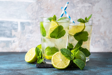 Mojito with rum and lime on black background. Tradition Summer drink with ice.の写真素材