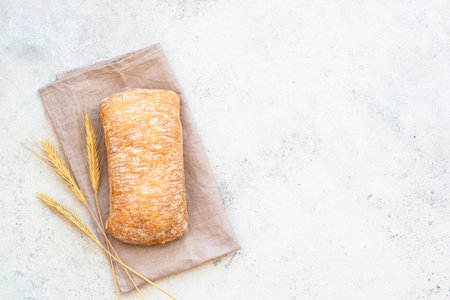 Italian Ciabatta bread on white background. Top view with space for text.の写真素材