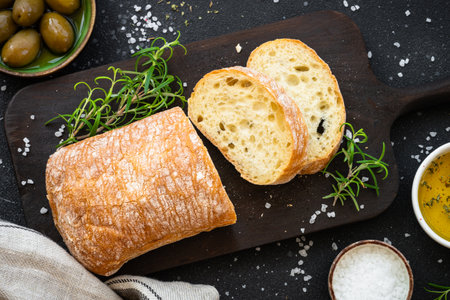 Greek food, Mediterranean food. Ciabatta bread with olive oil, olives and rosemary.