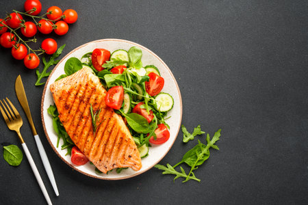 Healthy food plate, keto diet on black background. Top view with copy space.の写真素材