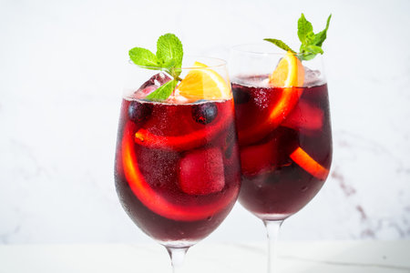 Sangria with fresh fruits and ice. Summer alcohol drink on white background. Close up image.の写真素材