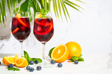 Sangria with fresh fruits and ice. Summer alcohol drink on white background.の写真素材