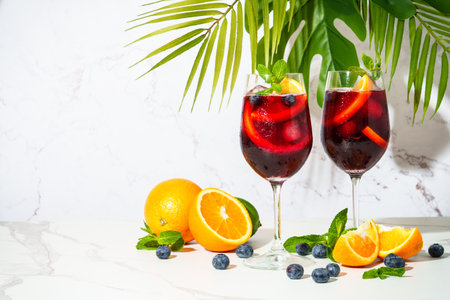 Sangria with fresh fruits and ice. Summer alcohol drink on white background.の写真素材