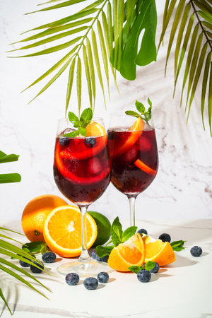 Summer alcohol drink, fruit cocktail. Sangria with fresh fruits and ice on white background.の写真素材