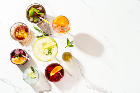 Alcohol cocktail drinks. Whiskey, margarita, aperol spritz, cuba libre, negroni, sangria and jin tonic at white background.の写真素材