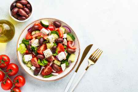 Greek salad, healthy food, mediterranean diet. Fresh vegetables, cheese and olive oil.の写真素材