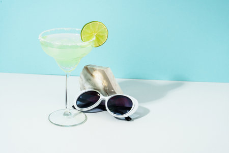 Margarita cocktail. Summer alcohol drink, sunny shadows.の写真素材