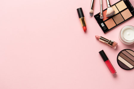 Makeup products flat lay background on pink.の写真素材