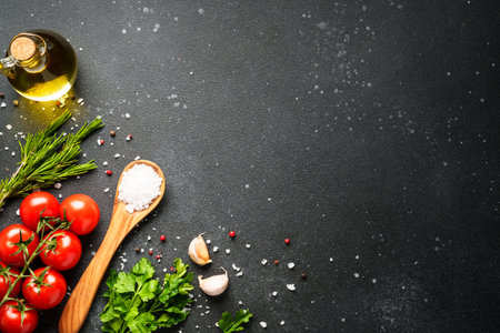Food background with fresh vegetables, herbs and spices on black.の写真素材