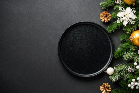 Christmas table setting, food background. Craft plate with golden Christmas decorations. Flat lay with copy space.の写真素材