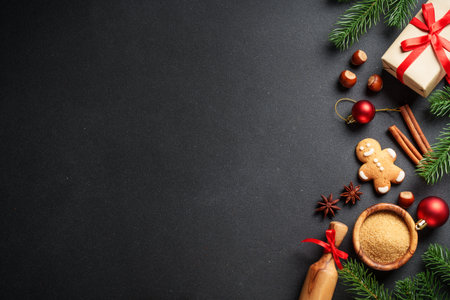 Christmas flat lay background. Gingerbread cookies, gift box, spices and Christmas decorations on...