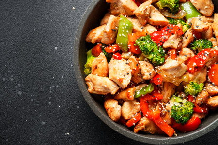 Chicken stir fry with vegetables and sesame.の写真素材