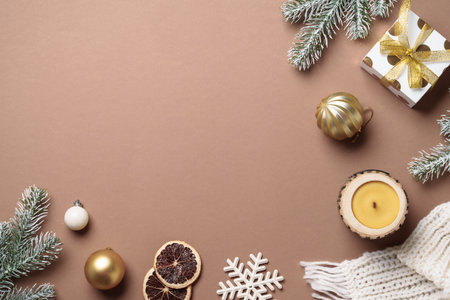 Cozy winter flat lay composition. Christmas decor, candle and white knitting scarf.の写真素材