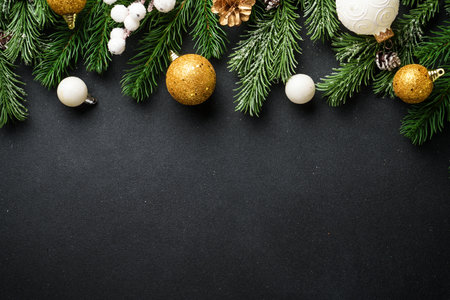 Christmas background or greeting card. Christmas white and golden decorations and spruce tree at...