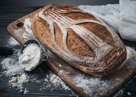 Freshly baked bread on a rustic wooden table.