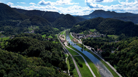 Aerial View of River Valley Between Green Mountains on Sunny Dayの写真素材