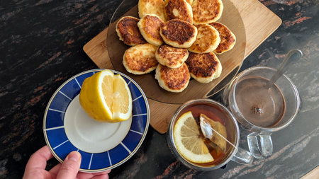 Golden Homemade Cottage Cheese Pancakes With Hot Tea For Breakfast