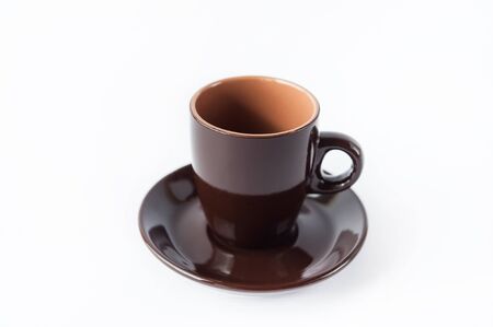 Beautiful little brown cup of coffee on a white backgroundの写真素材