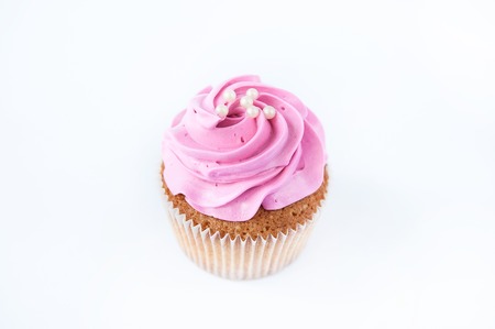 Cupcakes ( muffins ) with pink cream and beadsの写真素材