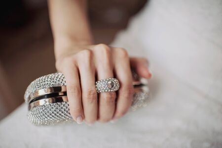 Clutch with rhinestones for the bride and the handle in the form of ringsの写真素材