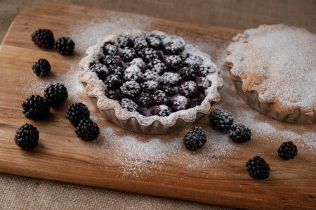 beautiful blackberry pie on a wooden tableの写真素材
