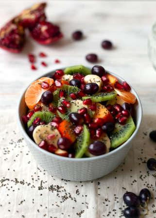 Fruit vitamin salad on a light backgroundの写真素材