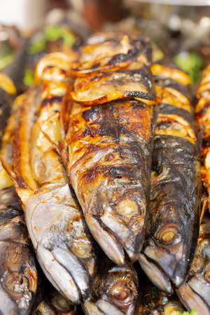 Fresh appetizing grilled mackerel with lemon slices, top view, front viewの写真素材
