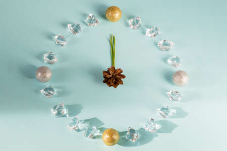 New year holiday clock on blue background, flat lay, copy spaceの写真素材