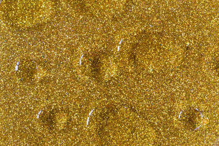 Divorces drops on a gold background, beauty in a simple, a solution for any design, a magical backgroundの写真素材