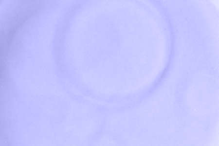 Oil stains in water. Close-up of defocused texture, selective focus. Color of the Year 2022 Veri Periの写真素材