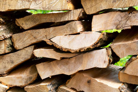 Pile of chopped wood. Preparing for winter. Firewood harvesting. Natural resources. Heating without gasの写真素材