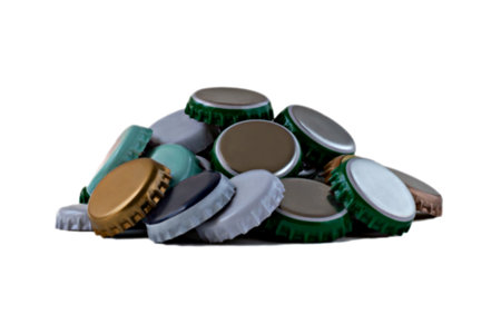 Many colorful iron bottle caps close-up isolated on white background. Concept of environmental...