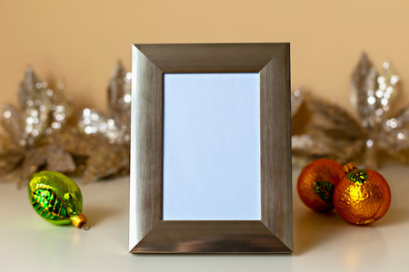 Mockup. Christmas. Silver photo frame stands prominently with blank space, surrounded by vibrant...