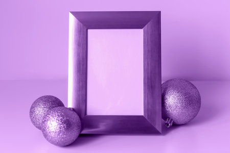 Mockup. Christmas. Decorative purple frame stands prominently with empty space for customization,...