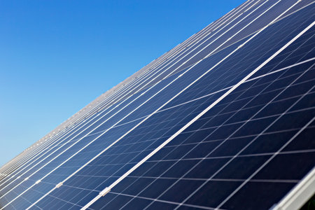 Solar panels. Solar panels capture sunlight efficiently under clear blue sky, emphasizing importance...