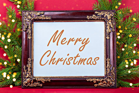 Merry Christmas. Elegant frame adorned with intricate details, surrounded by lush greenery and soft lights, presents cheerful holiday greeting, creating warm and inviting atmosphere for celebrationsの写真素材