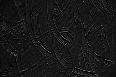 Black background of painted wall. Texture paint with elements of strips and patterns.の写真素材