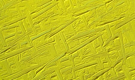 Green background of painted wall. Texture paint with elements of strips and patterns, fashionable color is a lime punch.の写真素材