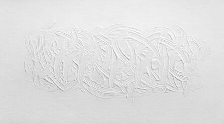 The texture of the paint is white. The background is drawn with a brush with a divorce on the wall.の写真素材