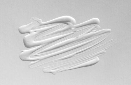 Texture of white paint with handmade brush strokes, decor elements for modern design. Abstract background for screensaver template and wedding card in gray gradient.の写真素材