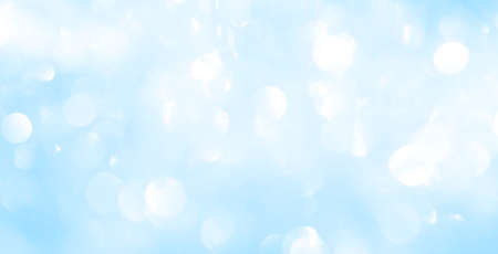 Bokeh light on blue background, sky with circle glitter light blue. Snow abstract soft glowing with...